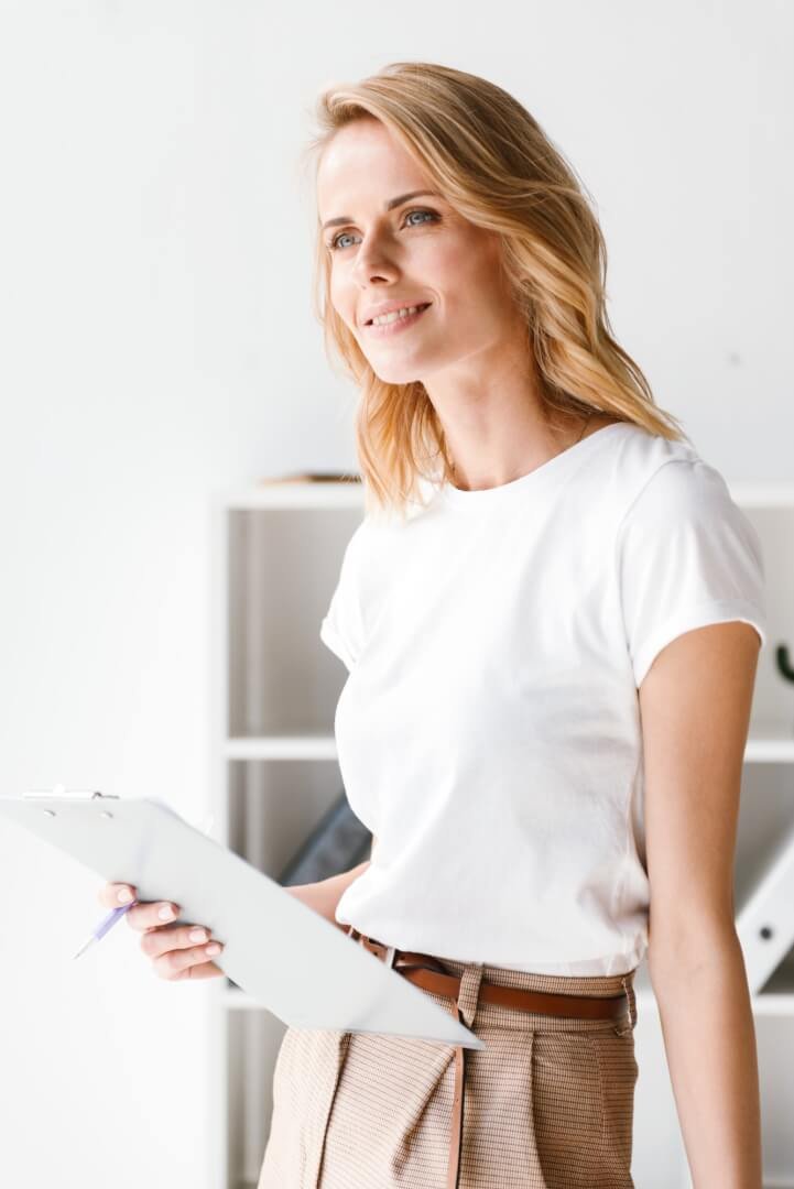 smiling-businesswoman-holding-folder.jpg